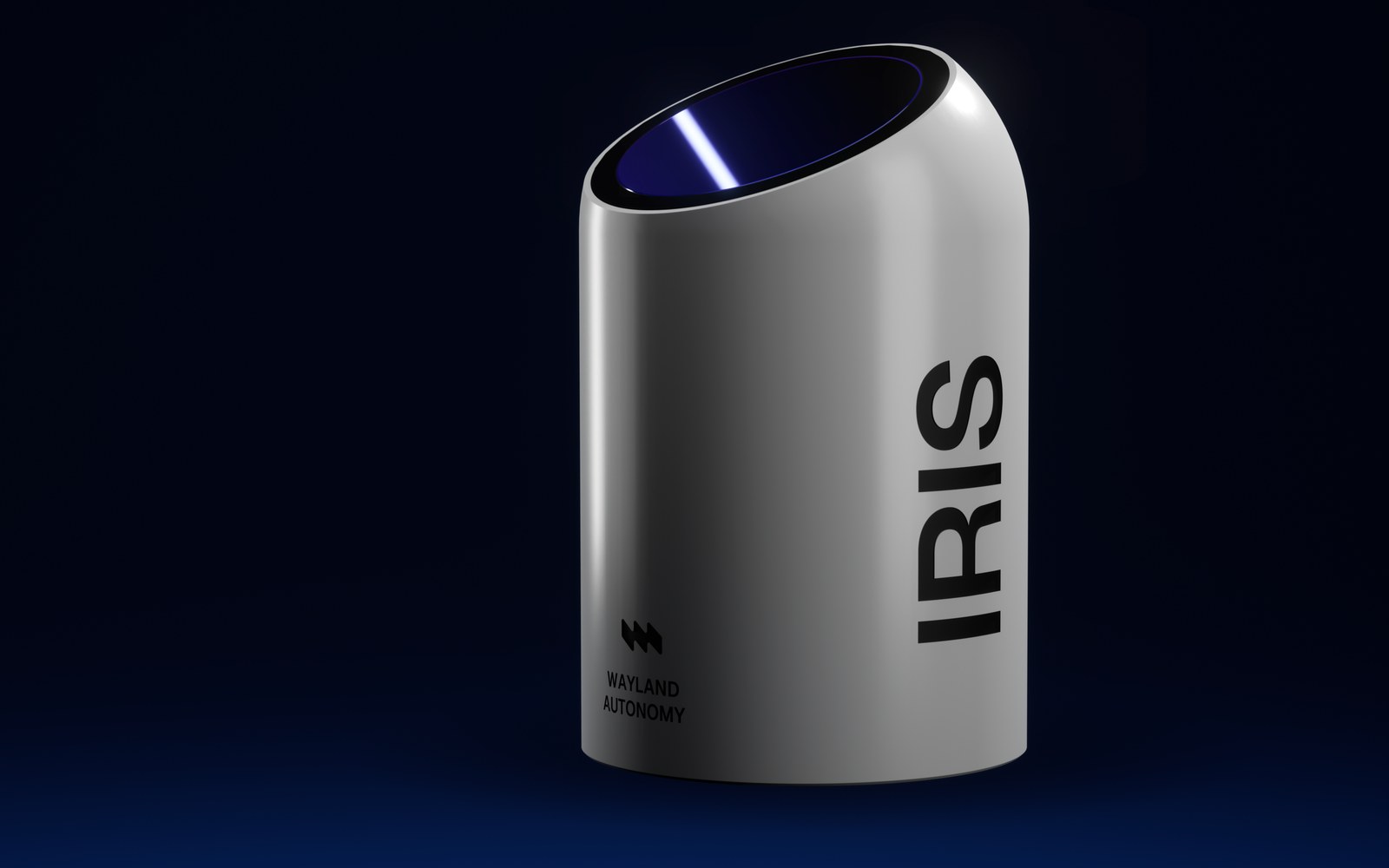 The IRIS pod, machined aluminium, on a black stage