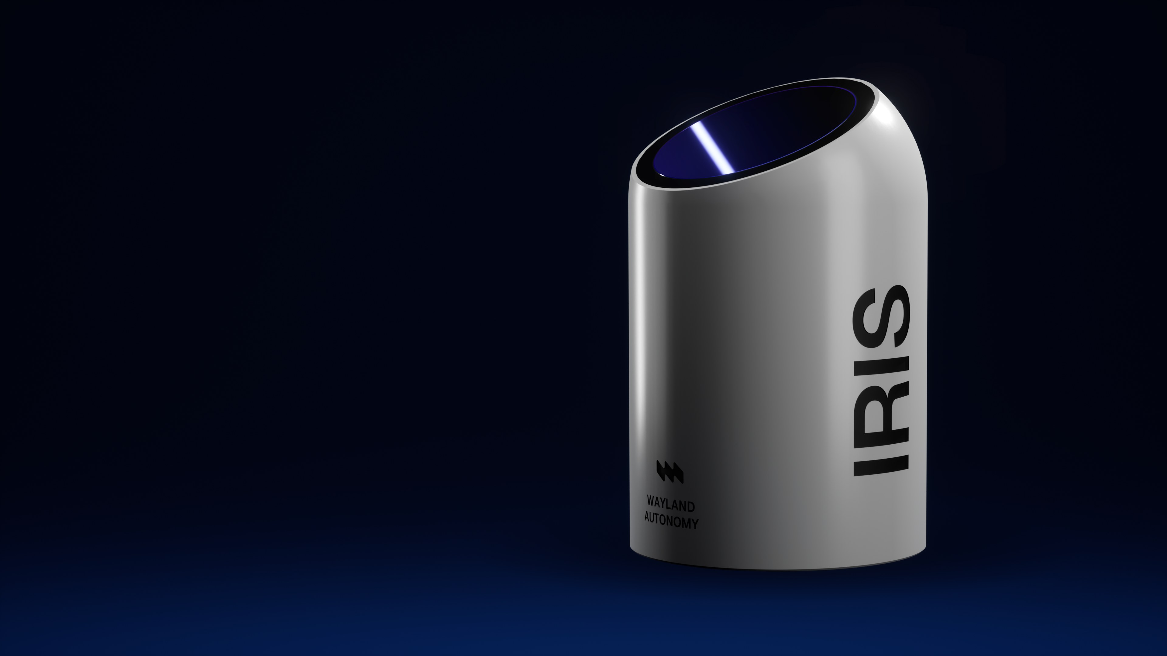 The IRIS pod, machined aluminium, on a black stage